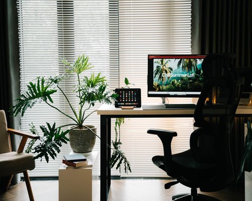 Comfortable home workspace with natural light, showing an ergonomic setup